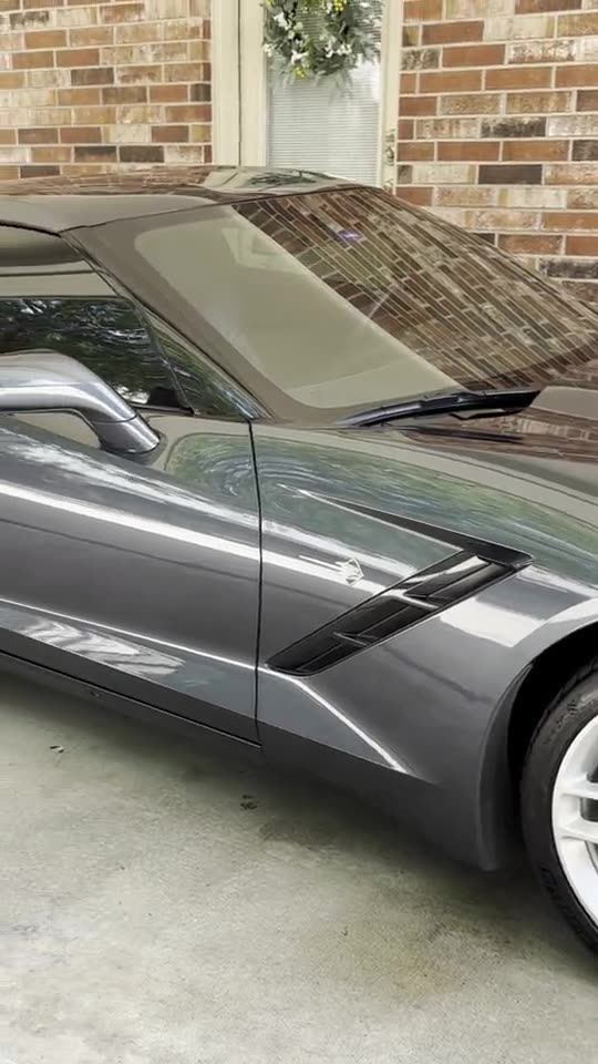 Video of a gray Chevrolet Corvette being foam washed and detailed